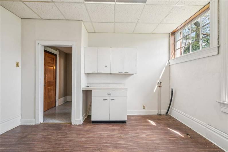 This utility room located off the dining room and kitchen suite is perfect for first floor laundry and pantry storage. Crafter and need more space for art supplies? This room is full of natural sunlight and overlooks the garden.
