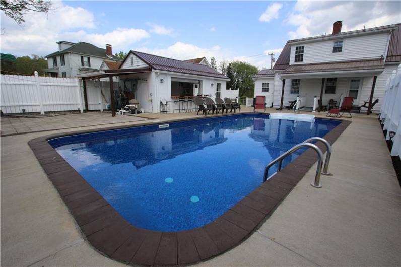 Refreshing 16x34 Inground Pool w/ New Liner, Lights & Attractive Bricks bordering exterior w/ Conveinet 14x20 Garage turned into Sheltered Party area for Summertime Fun & Pool Entertainment