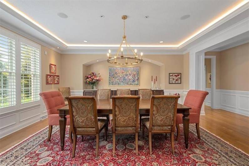 Dining Room is huge for entertaining with accent lighting and plantation shutters.