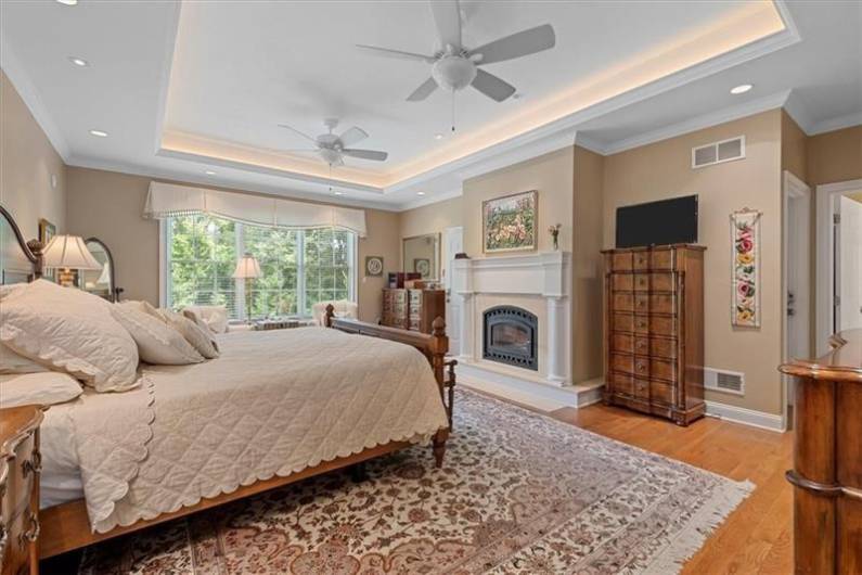 Master Bedroom with two walk-in closets with built-n safes and custom closet organizers.