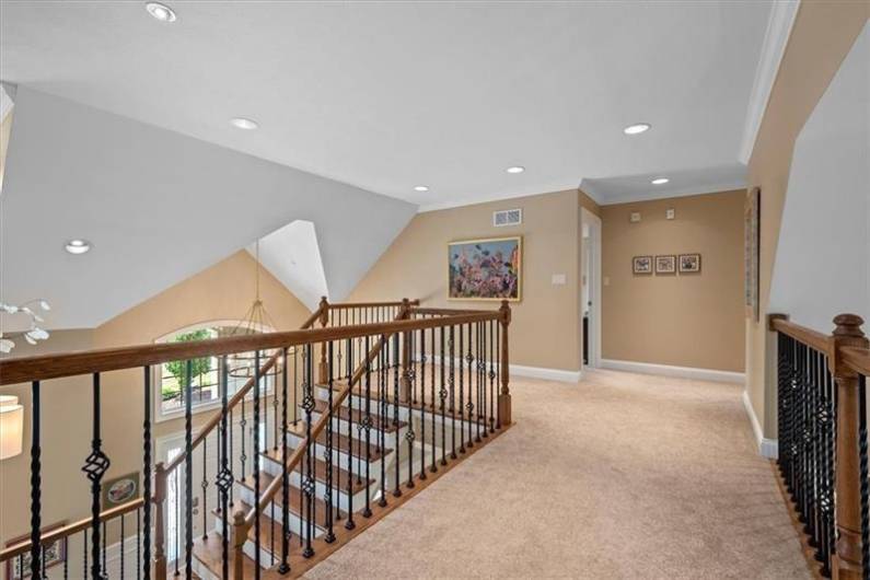Upper landing overlooking the entry and family room.