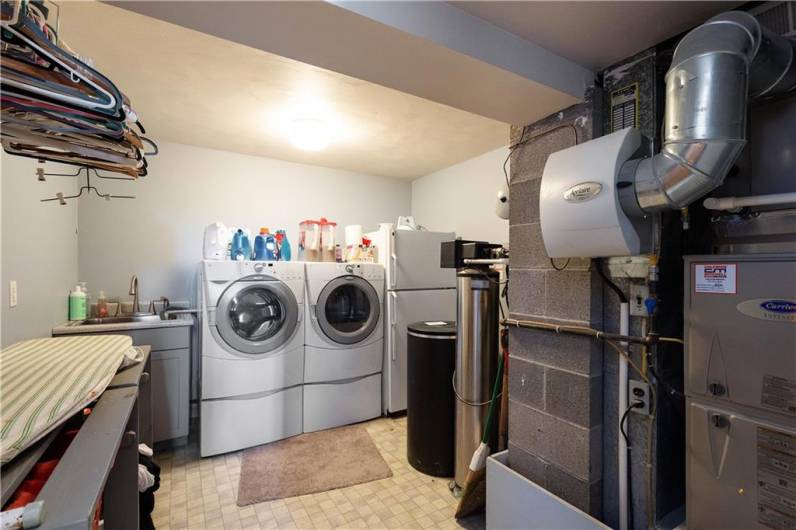 LIGHT AND BRIGHT ROOM FOR YOUR LAUNDRY CHORES. NEW FURNACE 11-2023 WITH HUMIDIFIER. WATER HEATER 2022 AND A WATER SOFTENER SYSTEM.