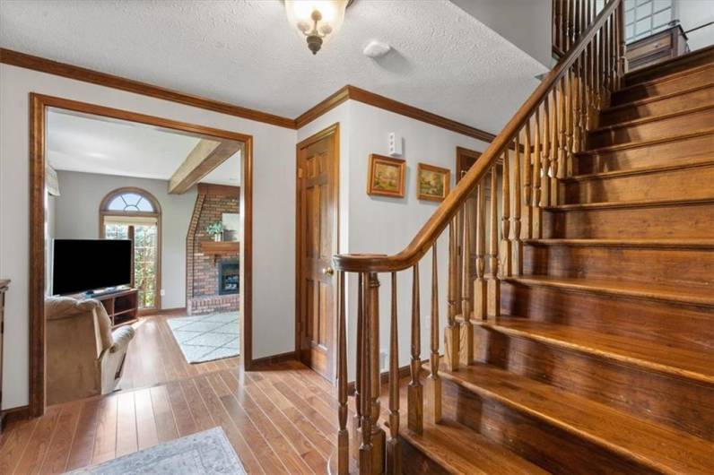 Beautiful wood staircase upon entry!