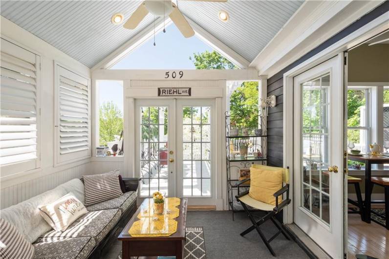 The vaulted ceiling in this sunroom adds interest and gives this room added character and fills it with natural light. It opens to the dining room and kitchen and makes it perfect when entertaining!