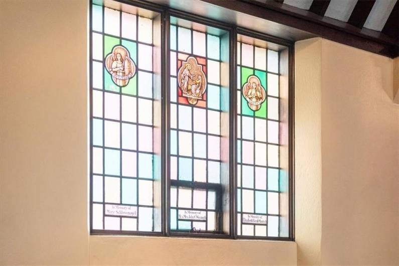 Stained glass windows engraved with the names of people who have made an impression on the church. Each picture tells a story.