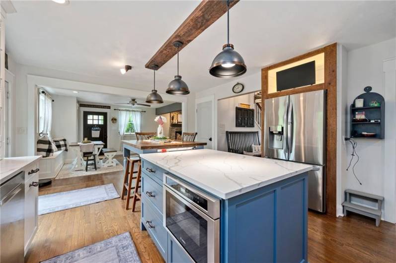Love this island with MORE cabinets space, eat in area, plus microwave space