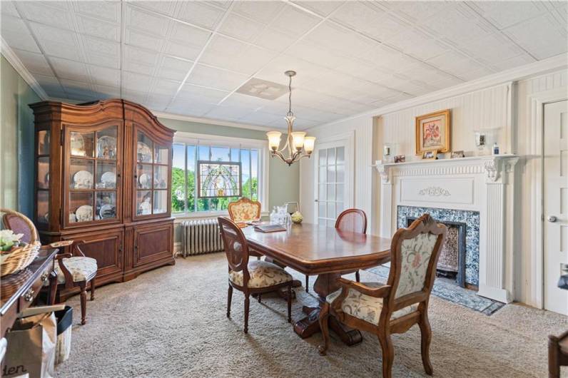 Dining room featuring large window and fireplace