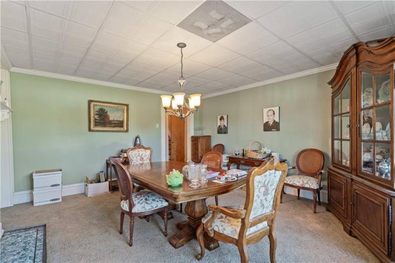 Dining room featuring large window and fireplace