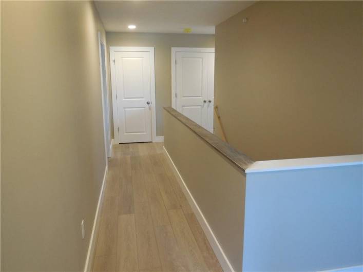 Hallway to extra storage and utiliti closet - 3rd bedroom - full bath and stairs.