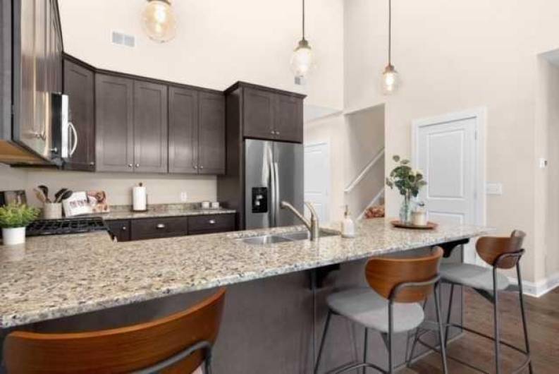 Peninsula serves as breakfast area and great entertaining space.