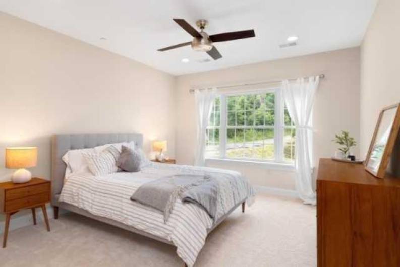 Spacious owner's suite expands to full bath and walk in closet.