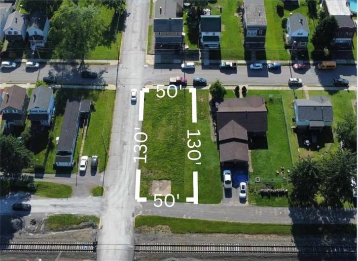 Your Canvas Awaits: Imagine your dream home or garage on this spacious, sun-kissed lot.