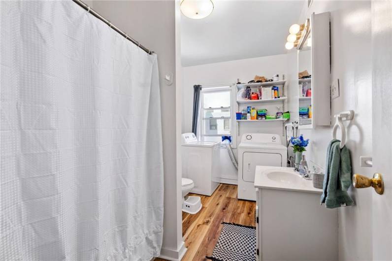 Full bathroom and laundry room