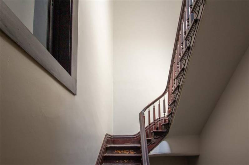 View of stairway to the 3rd floor apartment.