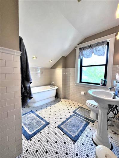 3rd floor apartment fully renovated bathroom with soaking tub and separate shower stall.