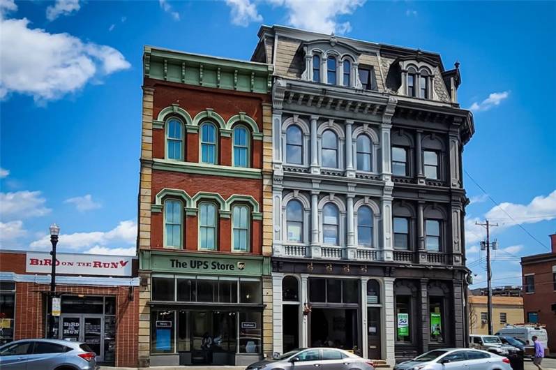 Front of Structure - The 1st floor tenant is a thriving coffee/cafe shop also occupying the mezzanine 1/2 floor.