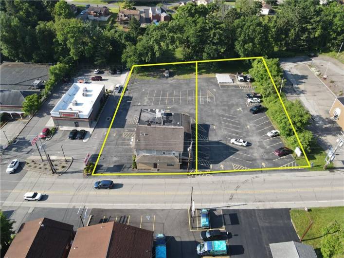 View of entire property, location of Ann's Chop house and property lines for both parcels totally approximately 1.20acres.  LOOK AT ALL of that parking!!!  In addition, the white square structure (top right corner) is a complete foundation (WITH BASEMENT - steps on right side) including water, gas, electric, and sewage - ready for yet another income producing building (previously a very successful ice cream shop) 20' x 25'