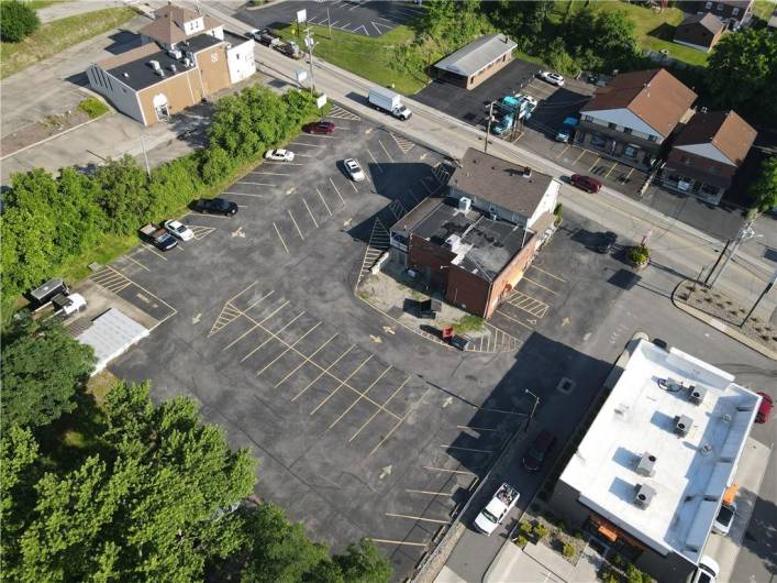 From left rear corner of property.  Notice the 2 entrances and tons of space for large delivery vehicles