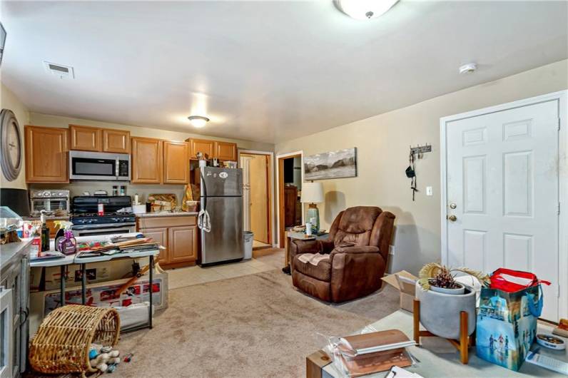 View of living room and kitchen area of Apartment #2. Doors in top center of photo lead to full bath and bedroom