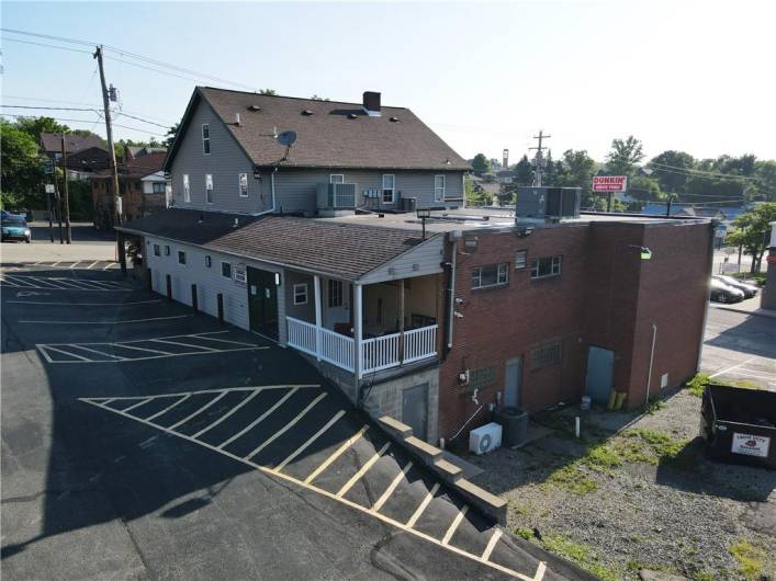 Right rear corner of Ann's Chop House w/ exterior covered patio, separate access for deliveries to the basement/office area.