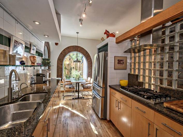 All updated appliances in kitchen with charming sitting area at the end