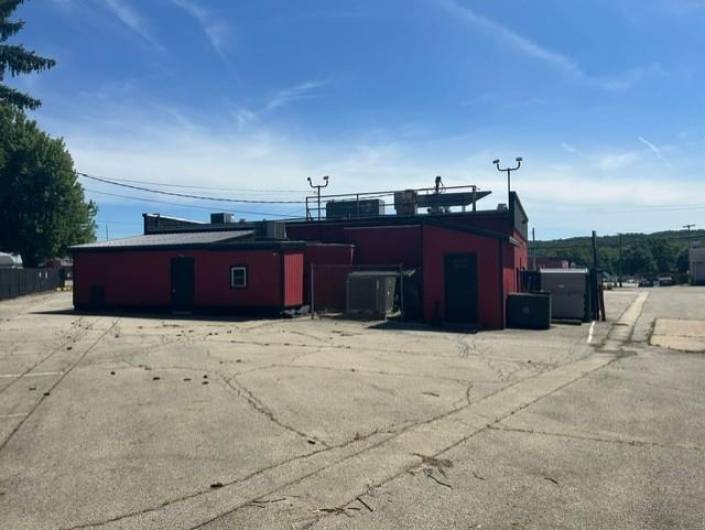 Rear of the building showing shed storage, newer hvac system