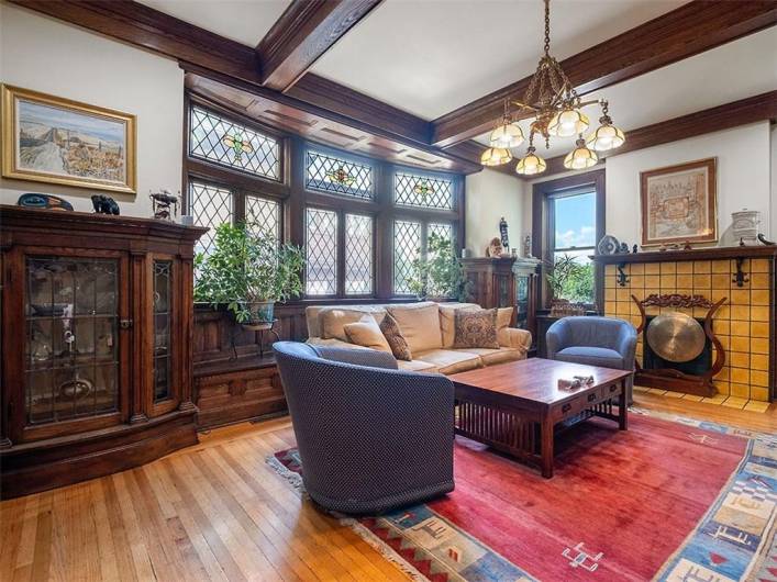 Family room with intricate woodwork and fireplace.