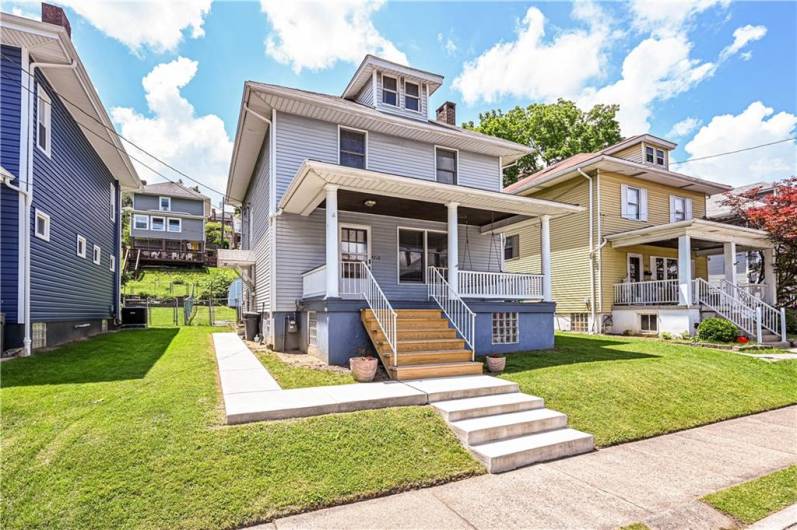 NEWER CONCRETE STEPS AND SIDEWALK TAKE YOU TO THE FRONT OF THE HOUSE OR TO THE SIDE DOOR AND LET'S NOT FORGET THE BACK PORCH.