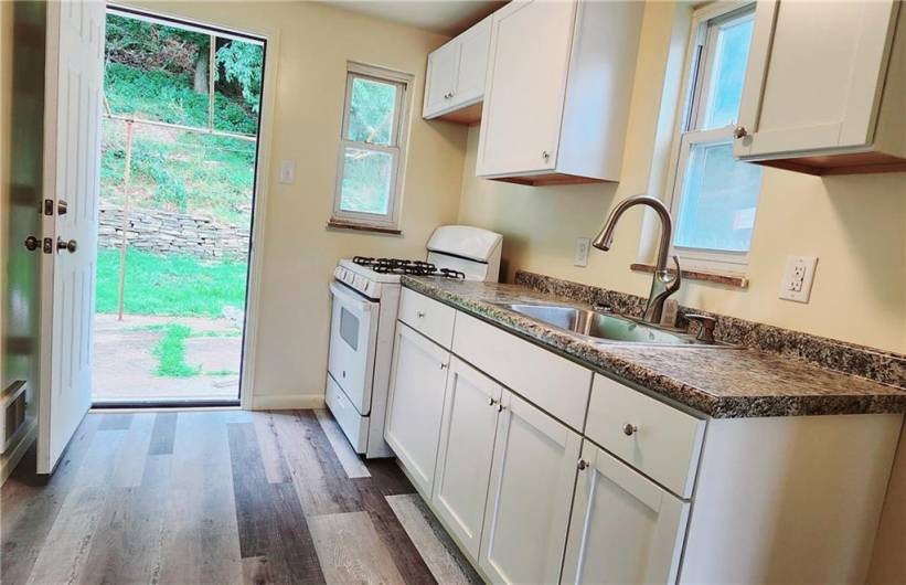 Kitchen to the back yard, making cook outs easy to entertian