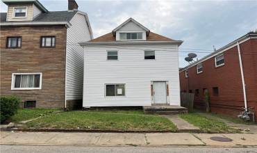 Check out this duplex. Brand NEW roof & white vinyl siding.