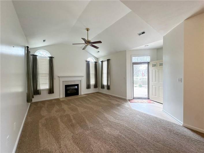 Vaulted ceiling with fan, new carpet, gas fireplace! Front door entry has new LVT flooring!