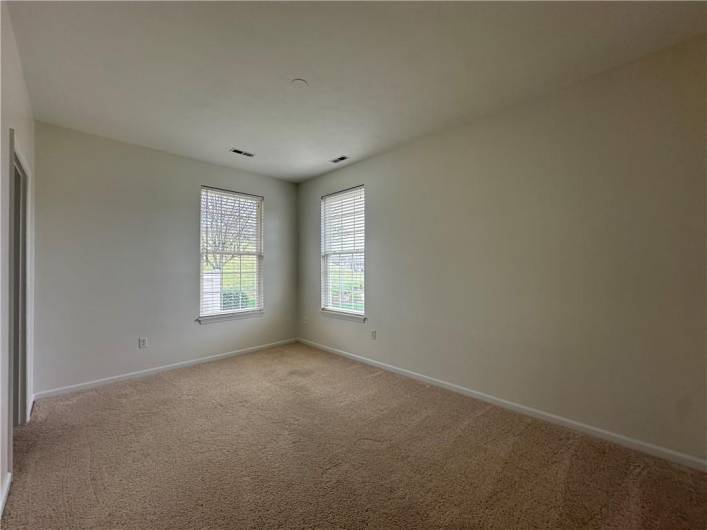 Secondary Bedroom or Den/Office on 1st Floor with walk-in closet, adjacent to Powder Room.