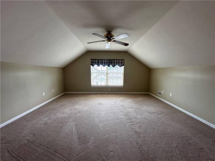 Spacious 2nd Floor Owner's Suite offering ceiling fan, walk-in closet and private full bath.