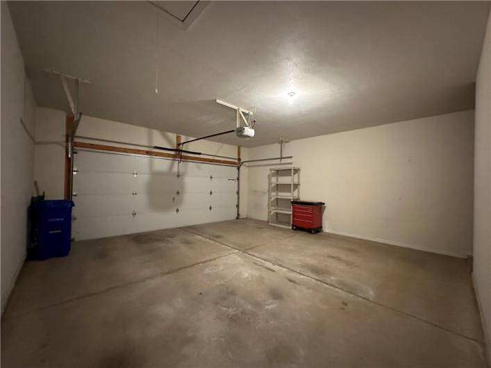 Spacious double garage with automatic door opener and keypad! Pull down stairs to extra storage area above garage.
