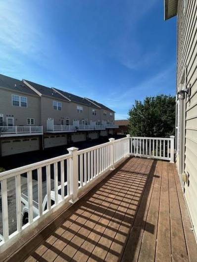 Large deck spans the entire width of the townhouse.