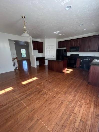 Beautiful large kitchen with island and plenty of space for a kitchen table.