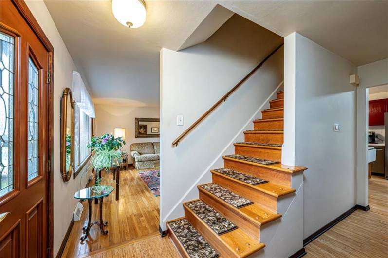 AS YOU WALK IN YOU CAN GO LEFT TO THE FORMAL LIVING ROOM OR TAKE THE STAIRS TO THE BEDROOMS ON THE 2ND FLOOR OR DOWN THE HALL TO THE KITCHEN AND LAUNDRY ROOM/PANTRY AREA.