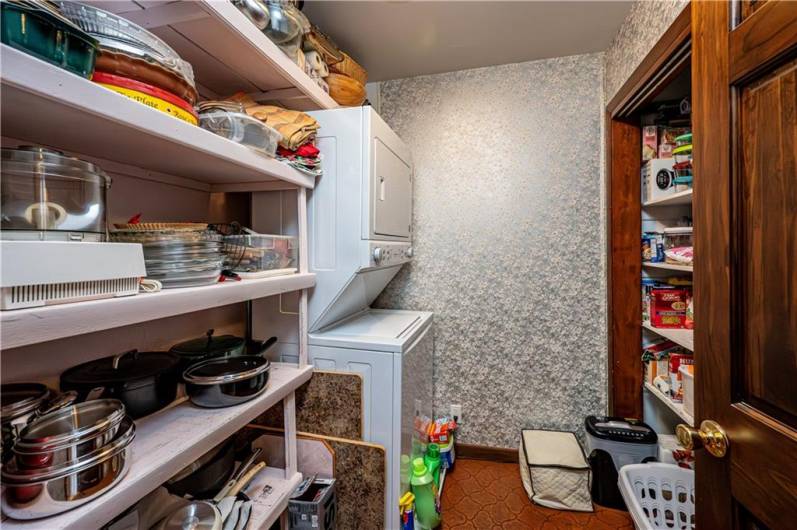 LAUNDRY ROOM IS ALSO A PANTRY, LOCATED RIGHT OUTSIDE THE KITCHEN