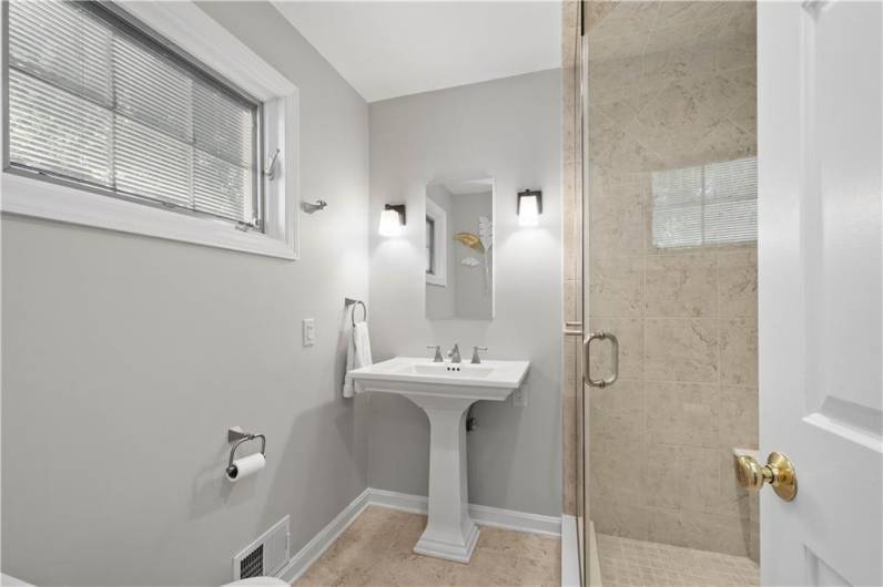 Enjoy the convenience of this first floor updated full bath with tile floor and shower.