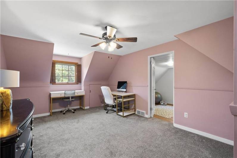 This spacious bedroom is large enough for two beds and then some. The captive room described in the prior photo could also be used as a gigantic walk in closet!