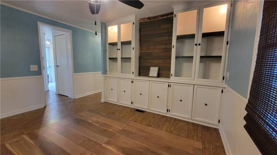 A special feature in this room is the built-in cabinetry.  Whether you display a china collection, fill them with books or your favorite collectibles, they'll be highlighted by the the vintage-look edison bulbs shining their light at the top of the glass-front doors.