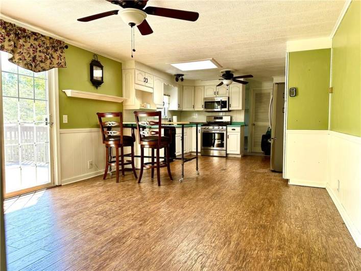 The big open Dining Area off of the kitchen can accomodate a large table.  The sliding door leads out to the back deck!