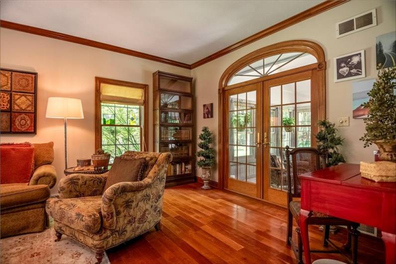 FRENCH DOORS LEAD TO ENCLOSED PATIO