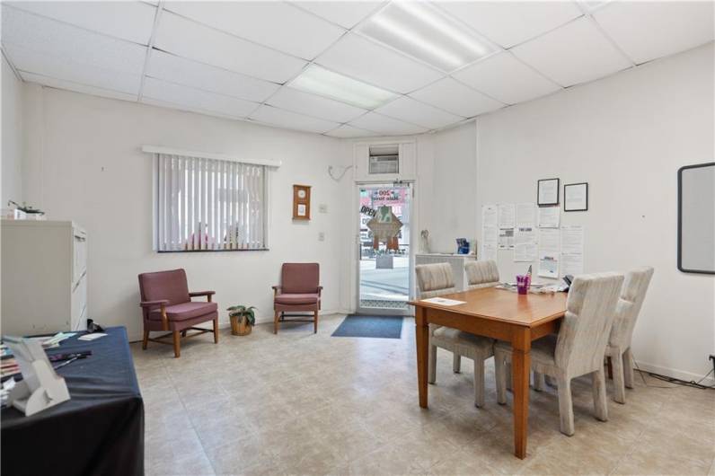 The front/corner office has this front room...