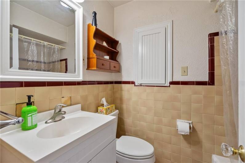 main level full bathroom with shower and bathtub