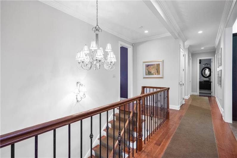 A view on the first floor of the staircase that goes to the lower level.