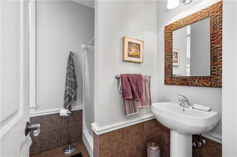 This full bathroom is located in the detached structure.