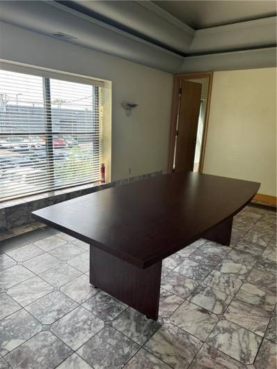 Conference room with marble flooring and indirect lighting