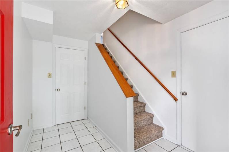 Tiled entryway with access from garage or front door