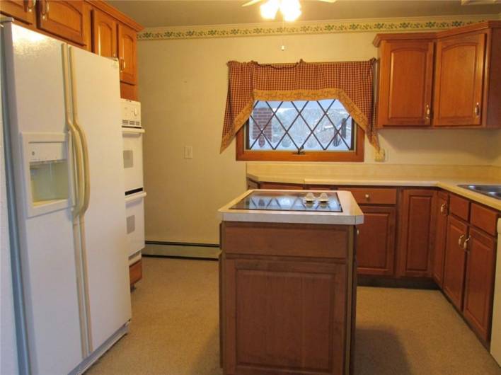 The Cherry Kitchen has double ovens and an electric island stovetop!